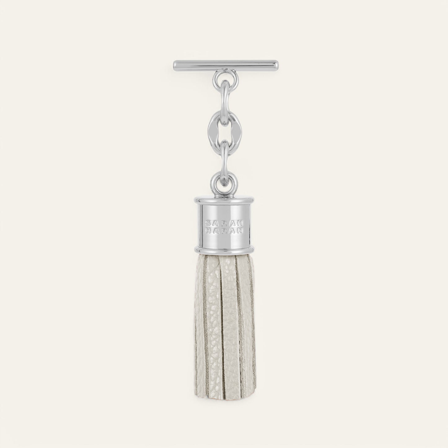Porcelain Sarah Haran Mini Capsule Tassel with Silver hardware Front