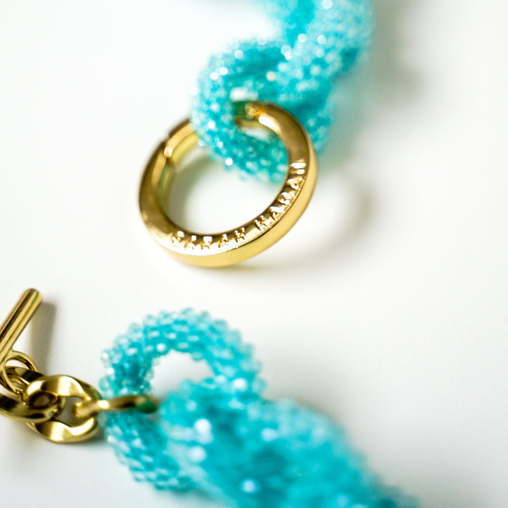 Turquoise Sparkle Sarah Haran Kings Knot Tassel with Gold hardware close up | G26-G