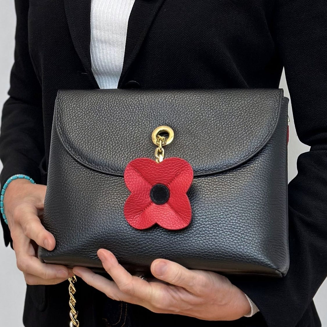 Pillarbox Red Black Sarah Haran SHape Tassel Flower with Gold hardware on bag 1 | RO19-G