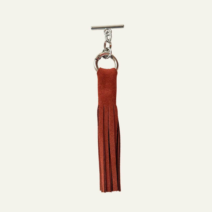 Rust Complimentary Gift Q1 Reservation: Suede Interchangable Tassel with Silver hardware Front | N40-S