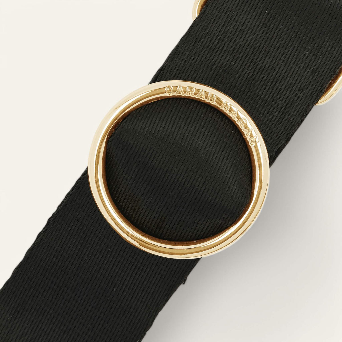 Black Sarah Haran River Strap with Gold hardware detail