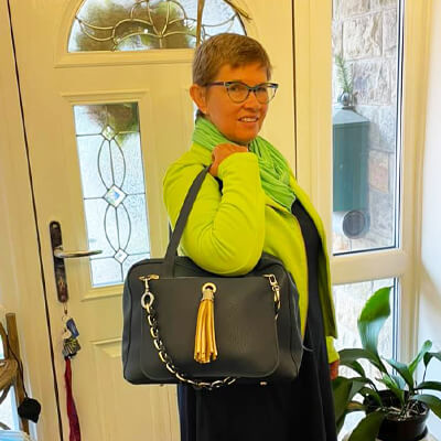 Jessica 2 in 1 zipped tote worn with a green jumper 