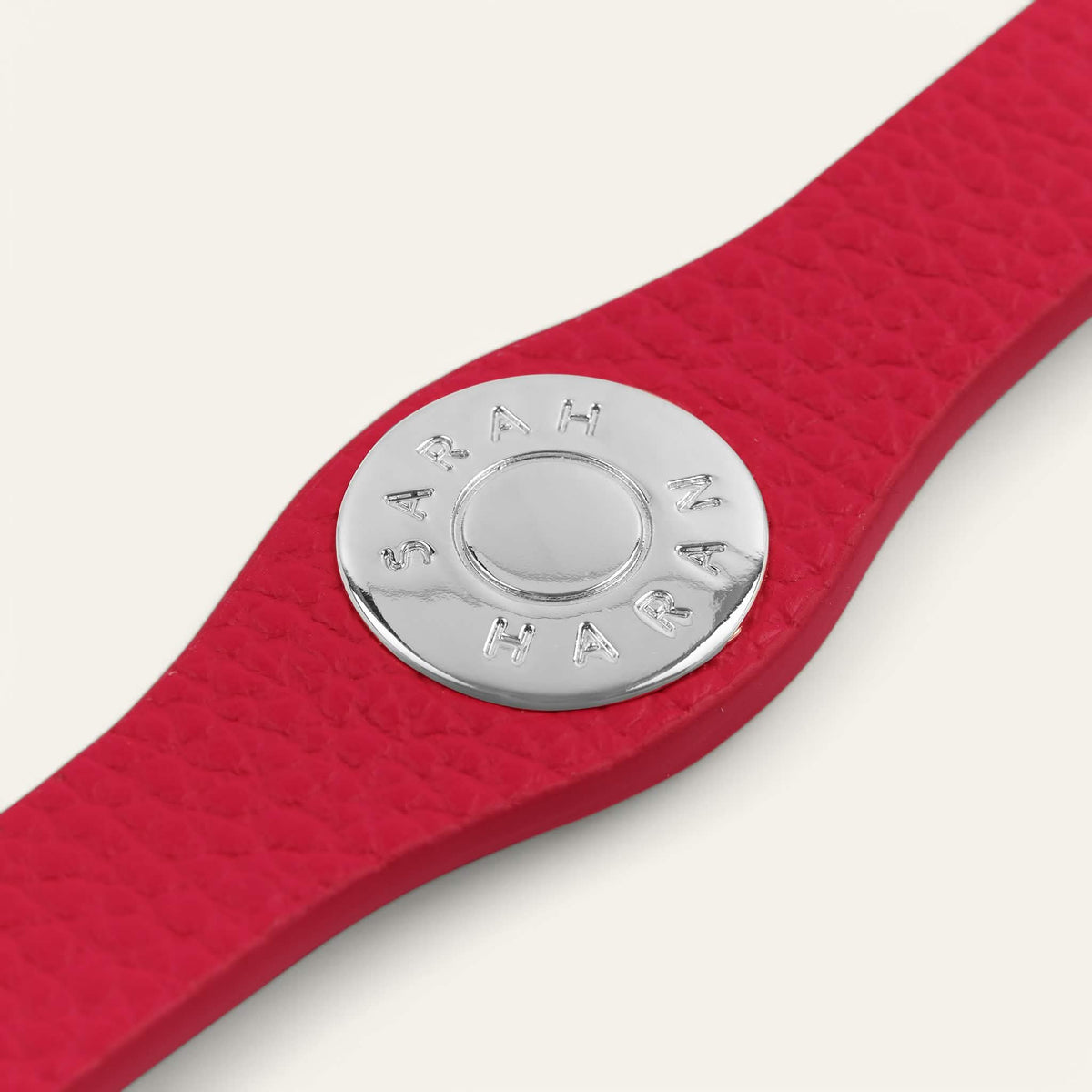 Pillarbox Red Sarah Haran Deco Logo with Silver hardware front