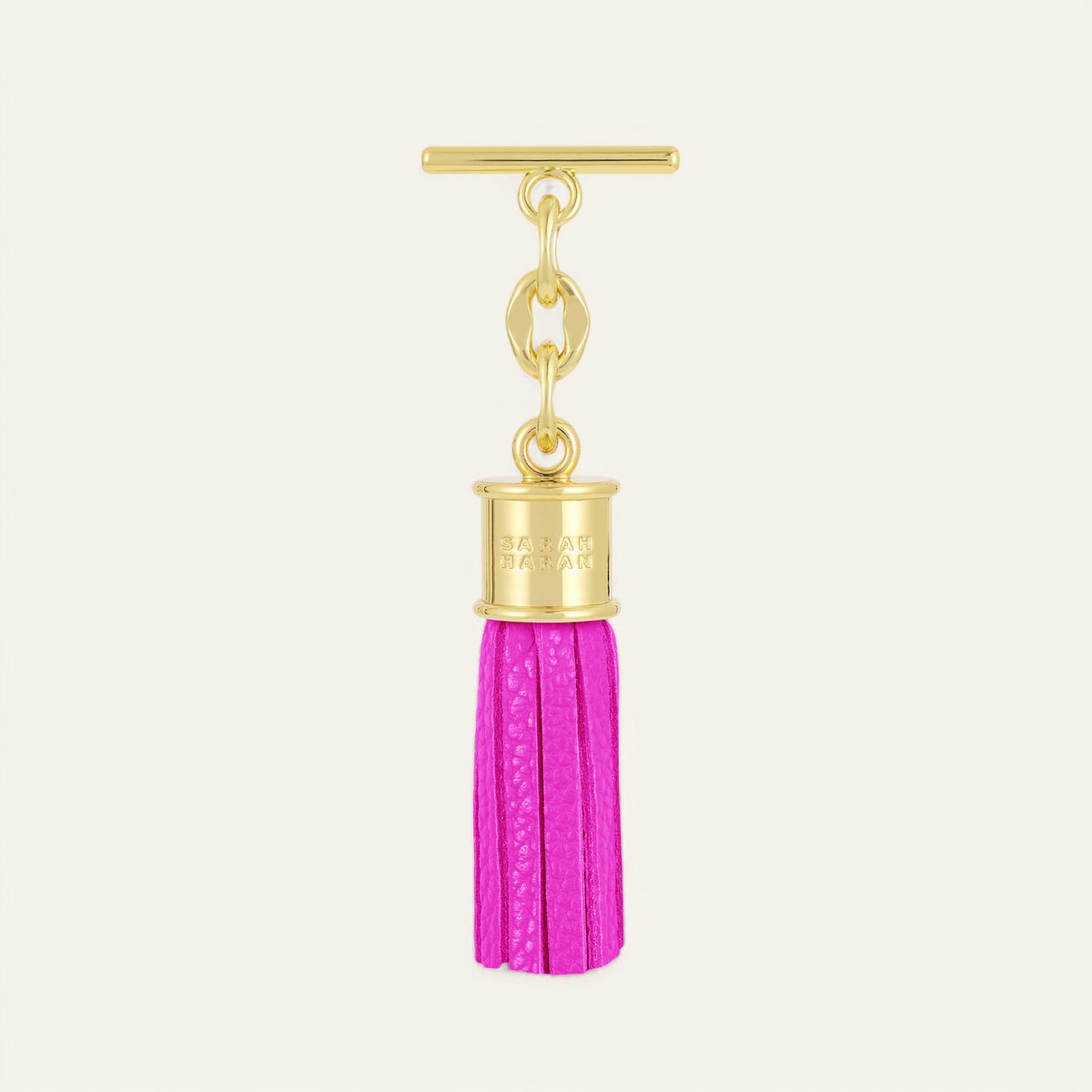 Pink Kiss Sarah Haran Mini Capsule Tassel with Gold hardware Front