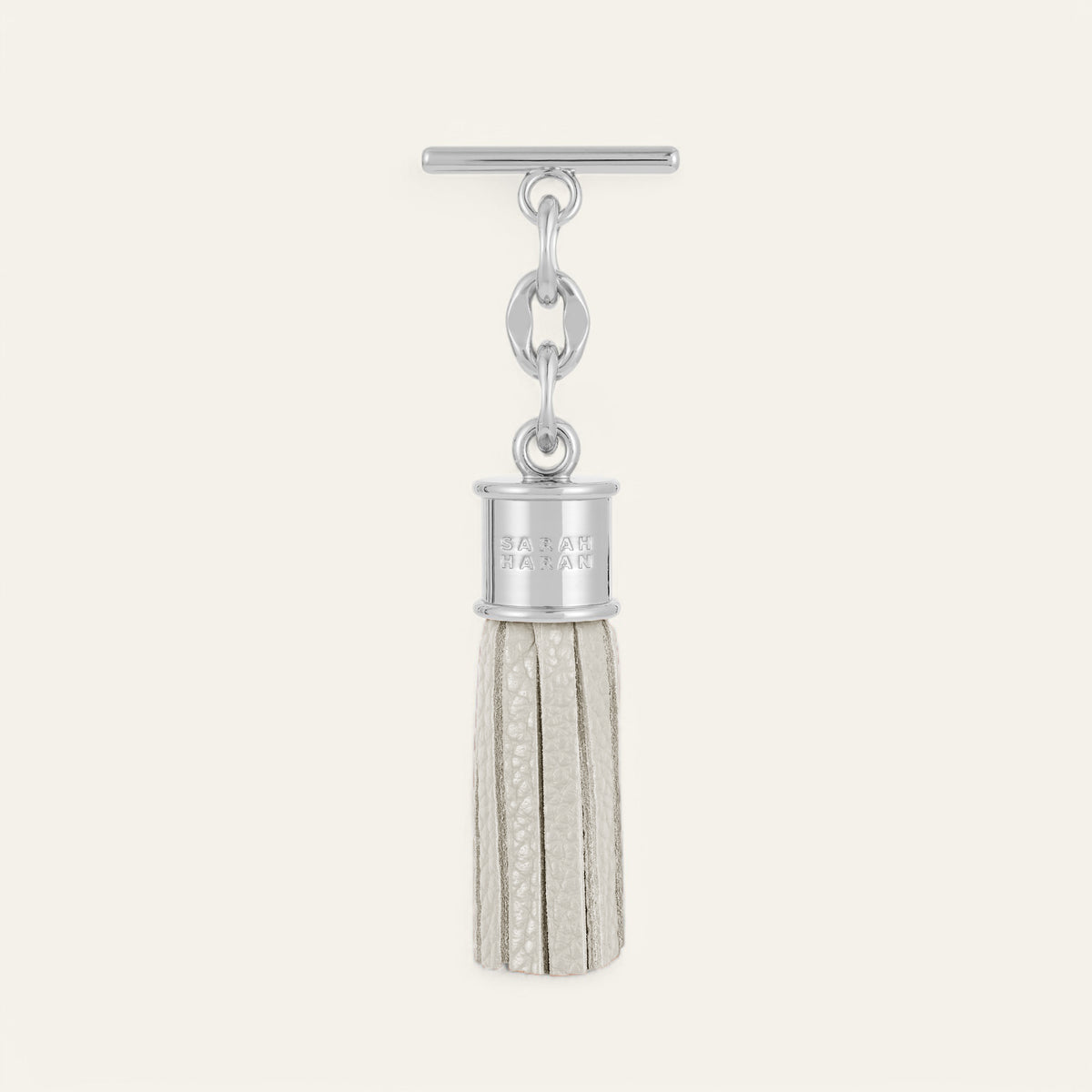 Porcelain Sarah Haran Mini Capsule Tassel with Silver hardware Front