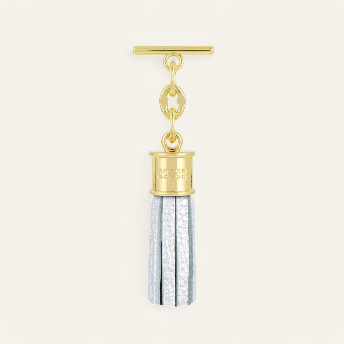 Soft Metallic Silver Sarah Haran Capsule Tassel Mini with Gold hardware front
